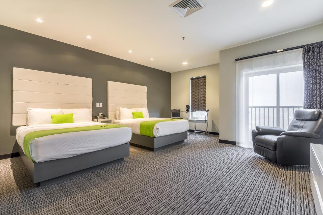 Queen Room with Two Queen Beds and Balcony - Non-Smoking at The Wallhouse Hotel, an Ascend Collection Hotel