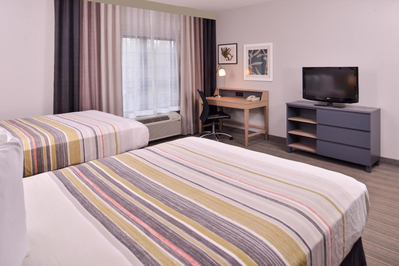 Queen Room with Two Queen Beds - Non-Smoking at Country Inn & Suites by Radisson, Raleigh-Durham Airport, NC