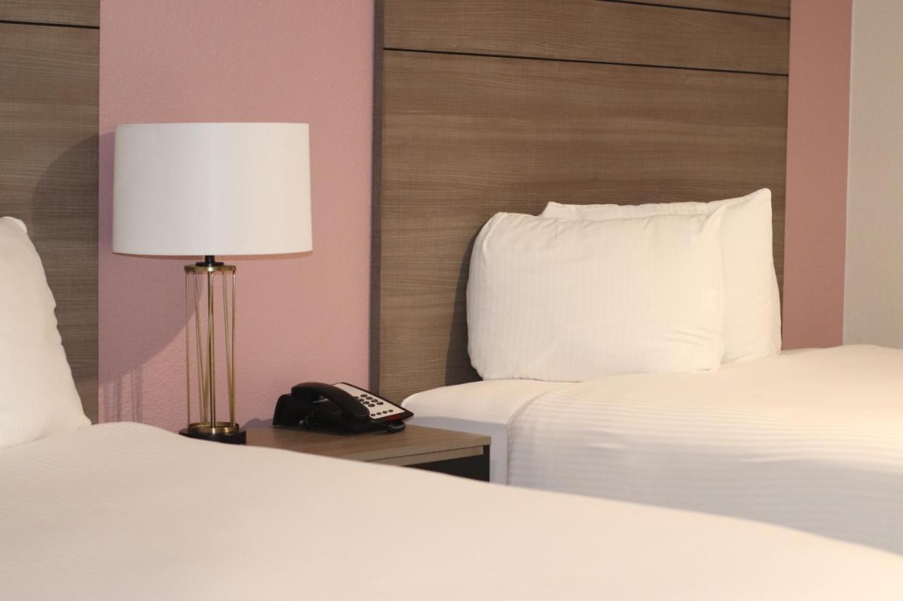 Queen Room with Two Queen Beds at Arya Inn & Suites