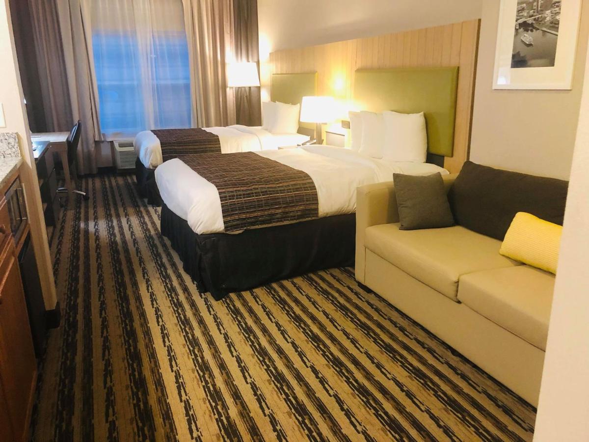 Premium Queen Room with Two Queen Beds at Country Inn & Suites by Radisson, Nashville Airport East, TN