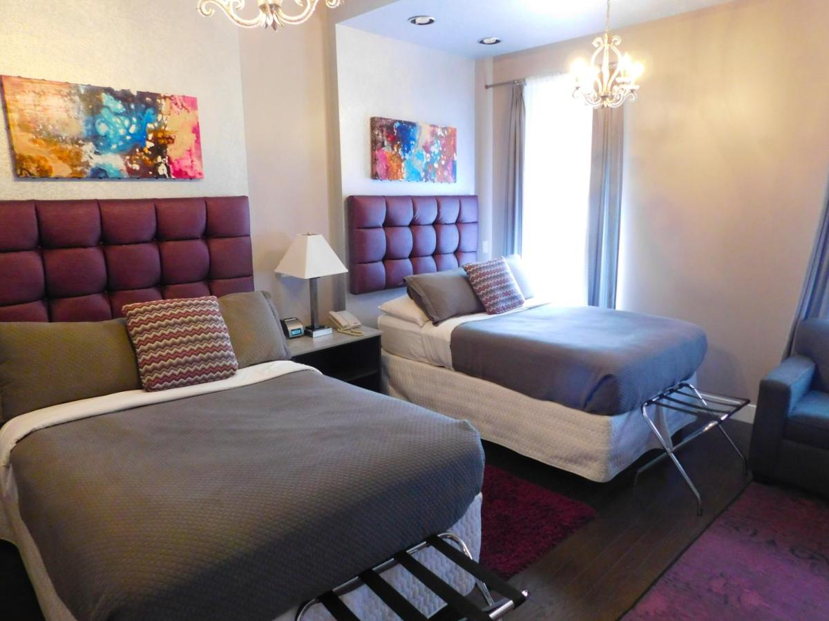 Large Double Room with Two Double Beds at The Historic Gould Hotel Seneca Falls, an Ascend Collection Hotel