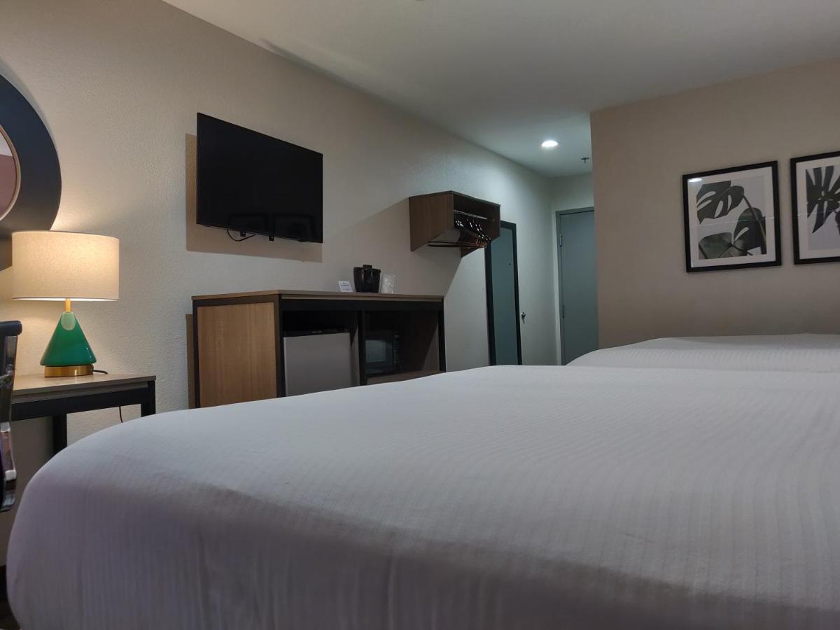 Queen Room with Two Queen Beds at Arya Inn & Suites