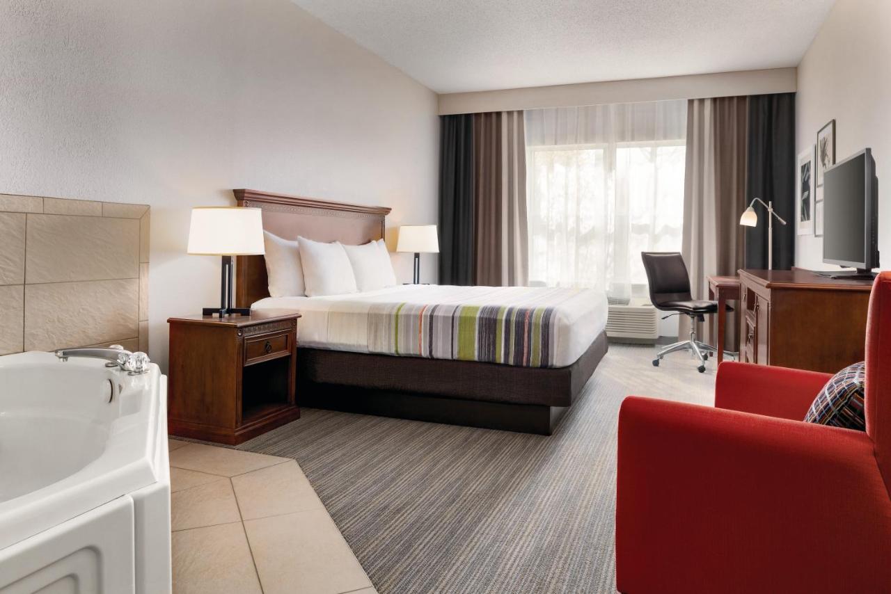 King Suite with Whirlpool and Roll-in Shower - Non-Smoking at Country Inn & Suites by Radisson, Marinette, WI
