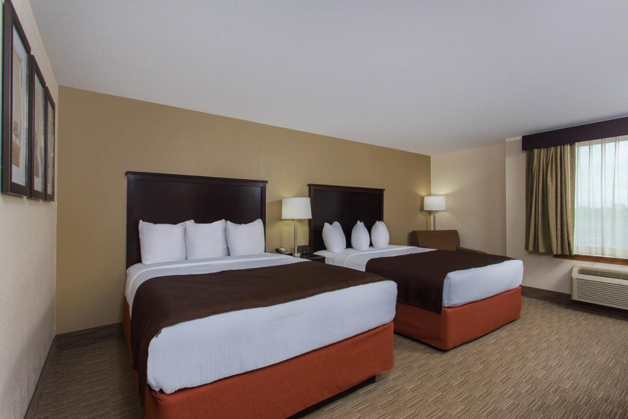 Queen Room with Two Queen Beds - Non-Smoking at AmericInn by Wyndham Janesville