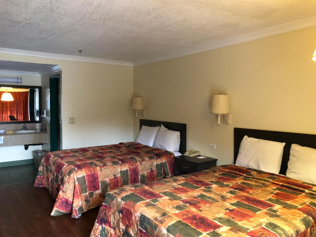 Queen Room with Two Queen Beds - Non-Smoking at Travelers Inn