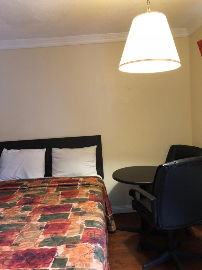 Queen Room with Two Queen Beds - Non-Smoking at Travelers Inn