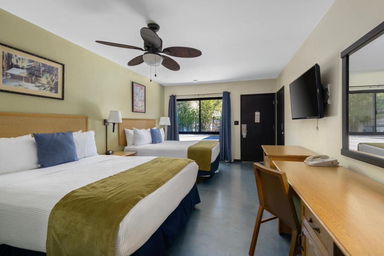 Deluxe Queen Room with Two Queen Beds at Caliente Tropics Hotel