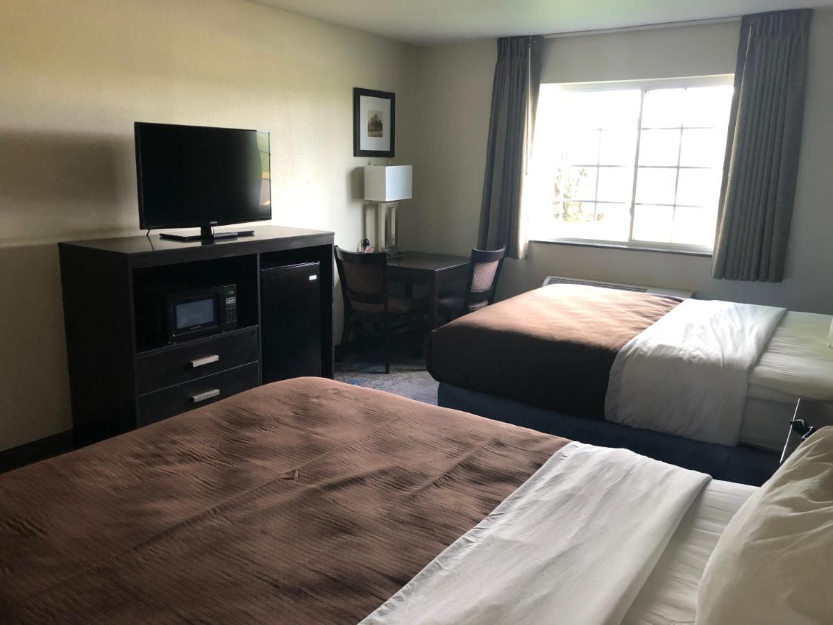 Queen Room with Two Queen Beds - Non-Smoking at AmericInn by Wyndham Maquoketa