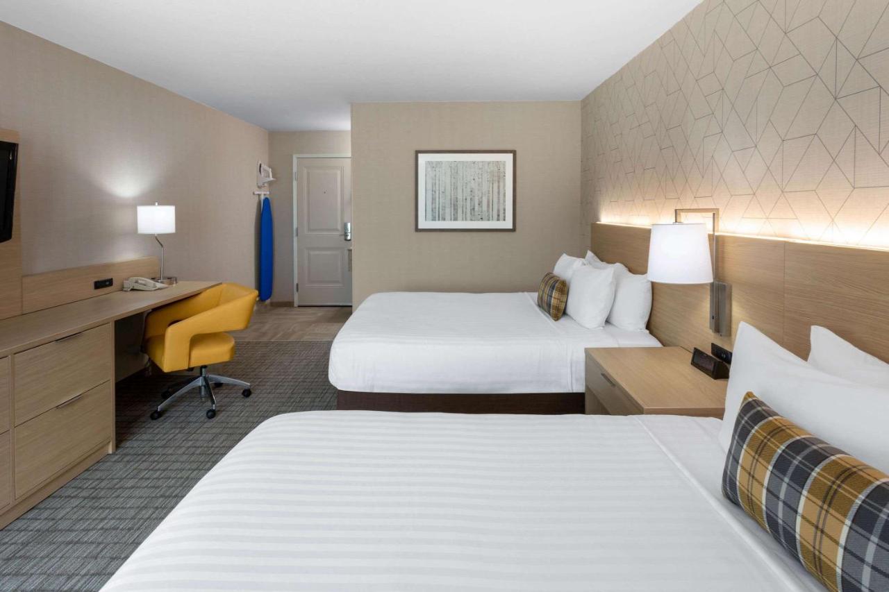 Queen Room with Two Queen Beds - Non-Smoking at Days Inn & Suites by Wyndham Duluth by the Mall