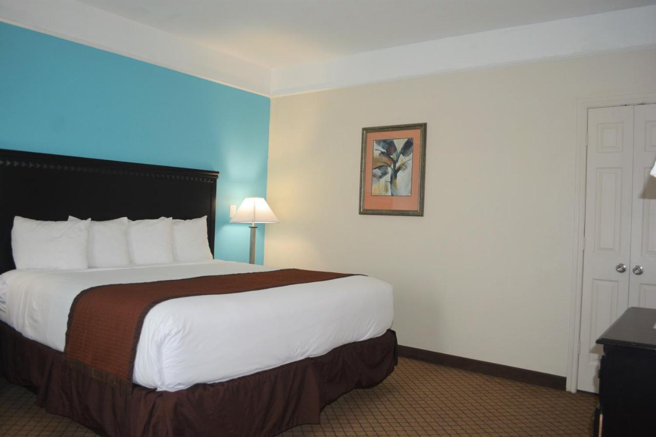 Studio King Suite with Two Queen Beds - Non-Smoking at Baymont by Wyndham Galveston
