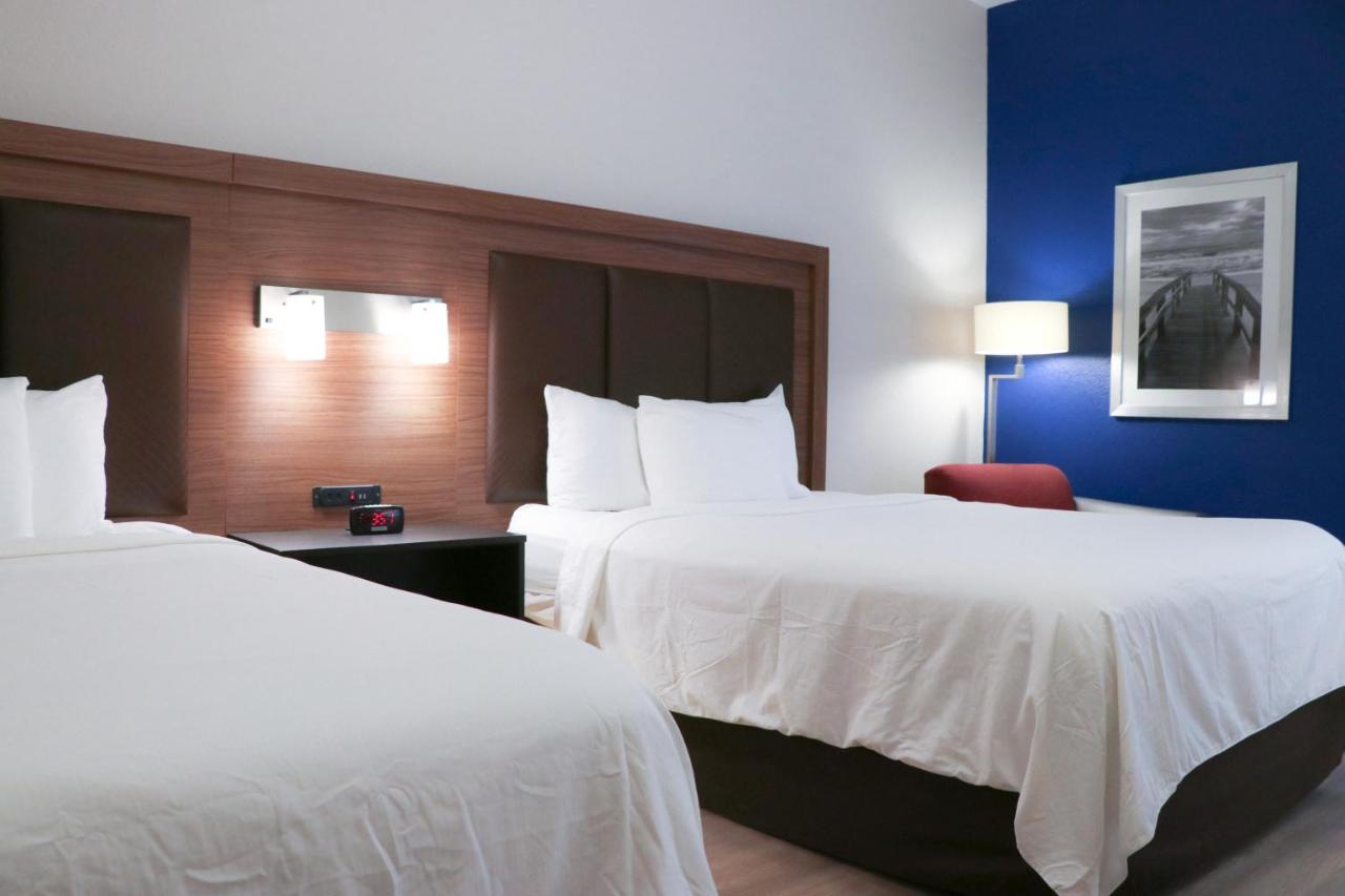 Queen Room with Two Queen Beds - Non-Smoking at Days Inn & Suites by Wyndham Fort Myers Near JetBlue Park