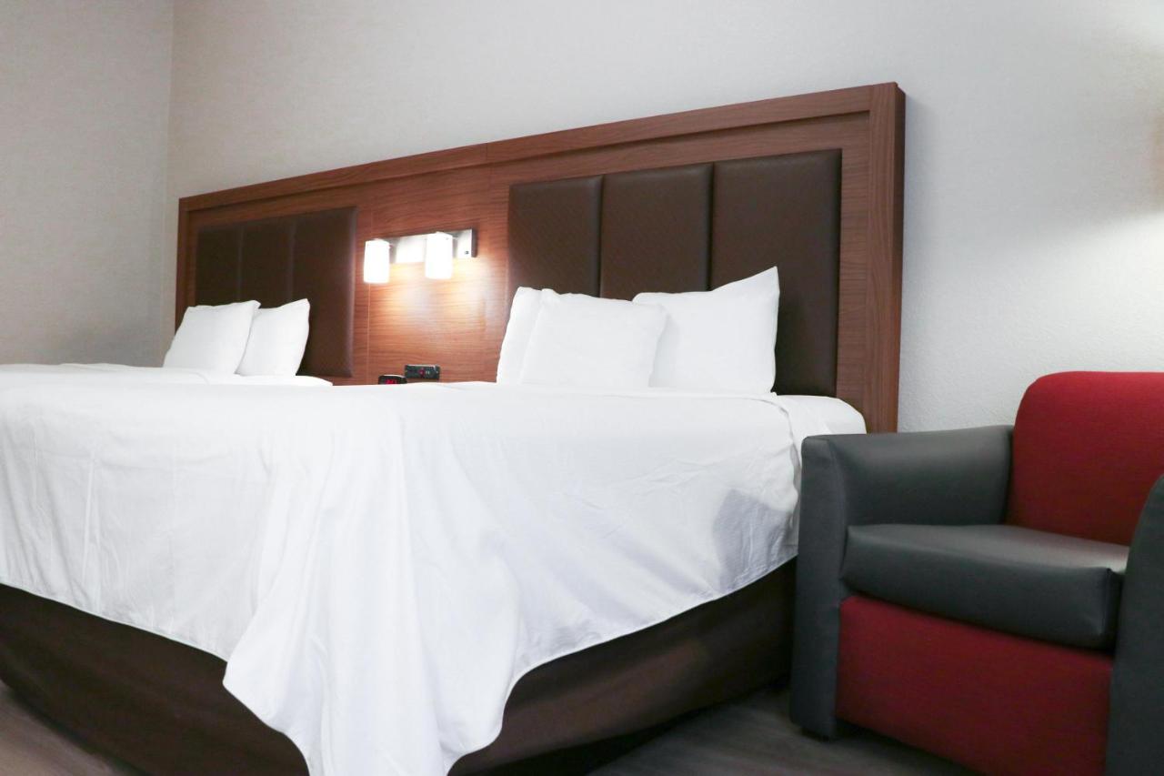Queen Room with Two Queen Beds - Non-Smoking at Days Inn & Suites by Wyndham Fort Myers Near JetBlue Park