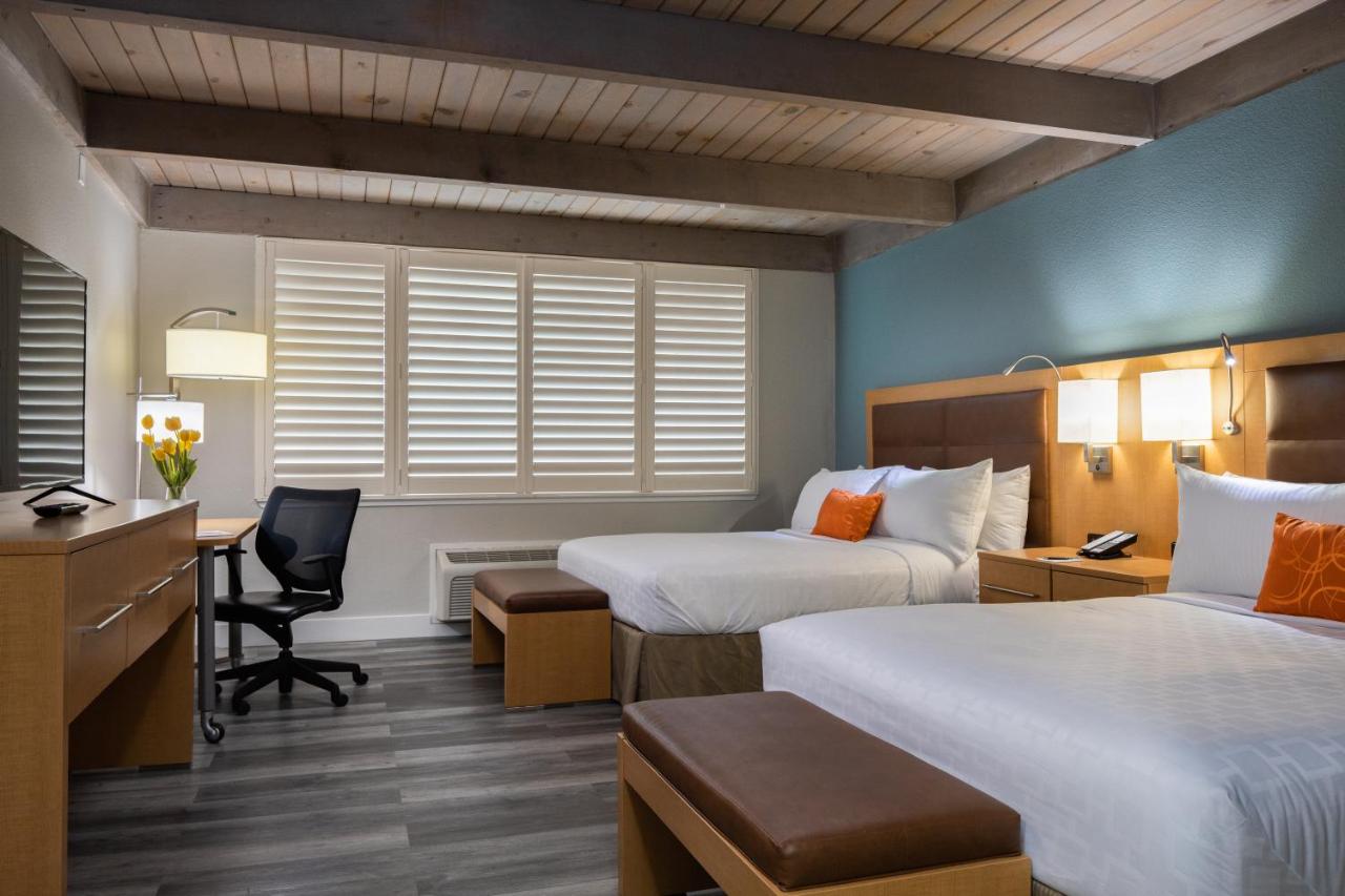 Queen Room with Two Queen Beds and Bath Tub - Mobility Accessible/Non-Smoking at Prodigy Hotel, a Days Inn by Wyndham