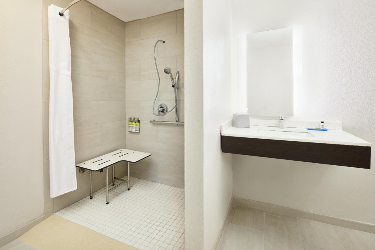 King Suite with Hearing Accessible Roll In Shower - Non-Smoking at Holiday Inn Express Hotel & Suites Port Richey by IHG