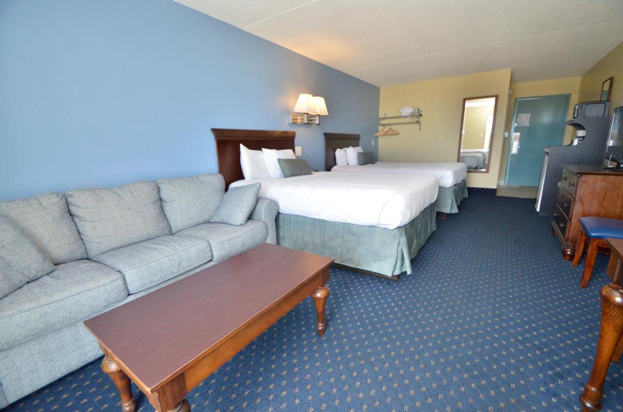 Partial Ocean View 2 Queens & Sofa - No Pets Allowed at Coastal Palms Inn & Suites