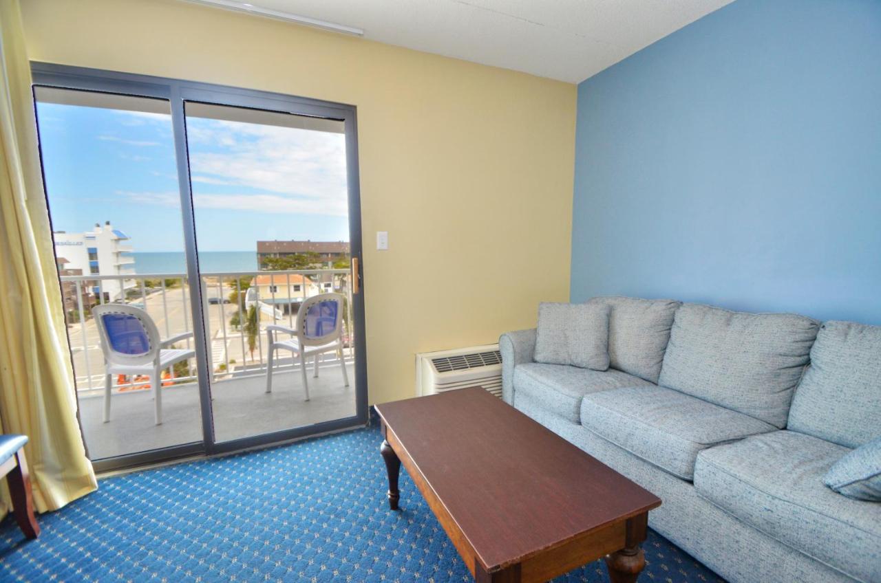 Partial Ocean View 2 Queens & Sofa - No Pets Allowed at Coastal Palms Inn & Suites