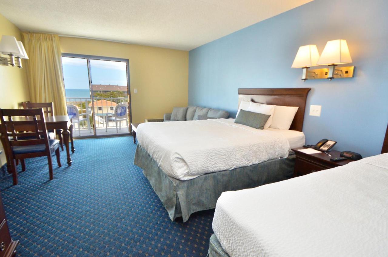 Partial Ocean View 2 Queens & Sofa - No Pets Allowed at Coastal Palms Inn & Suites
