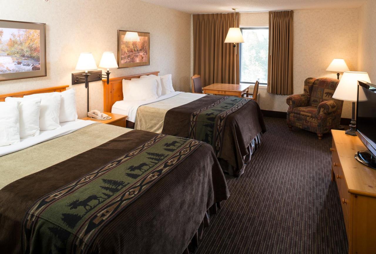 Queen Room with Two Queen Beds at Kelly Inn & Suites Mitchell South Dakota