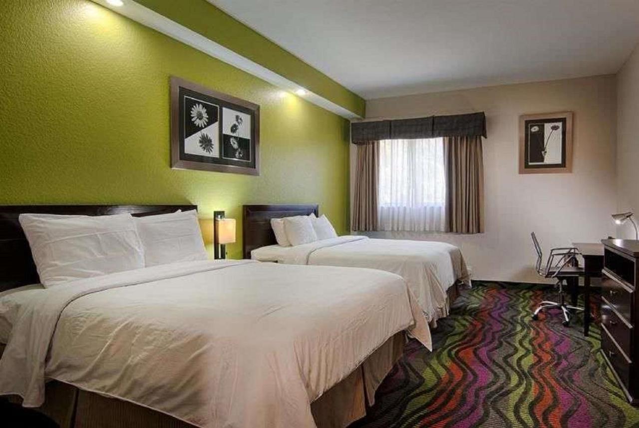 Queen Room with Two Queen Beds - Non-Smoking at Days Inn & Suites by Wyndham Bonita Springs North Naples