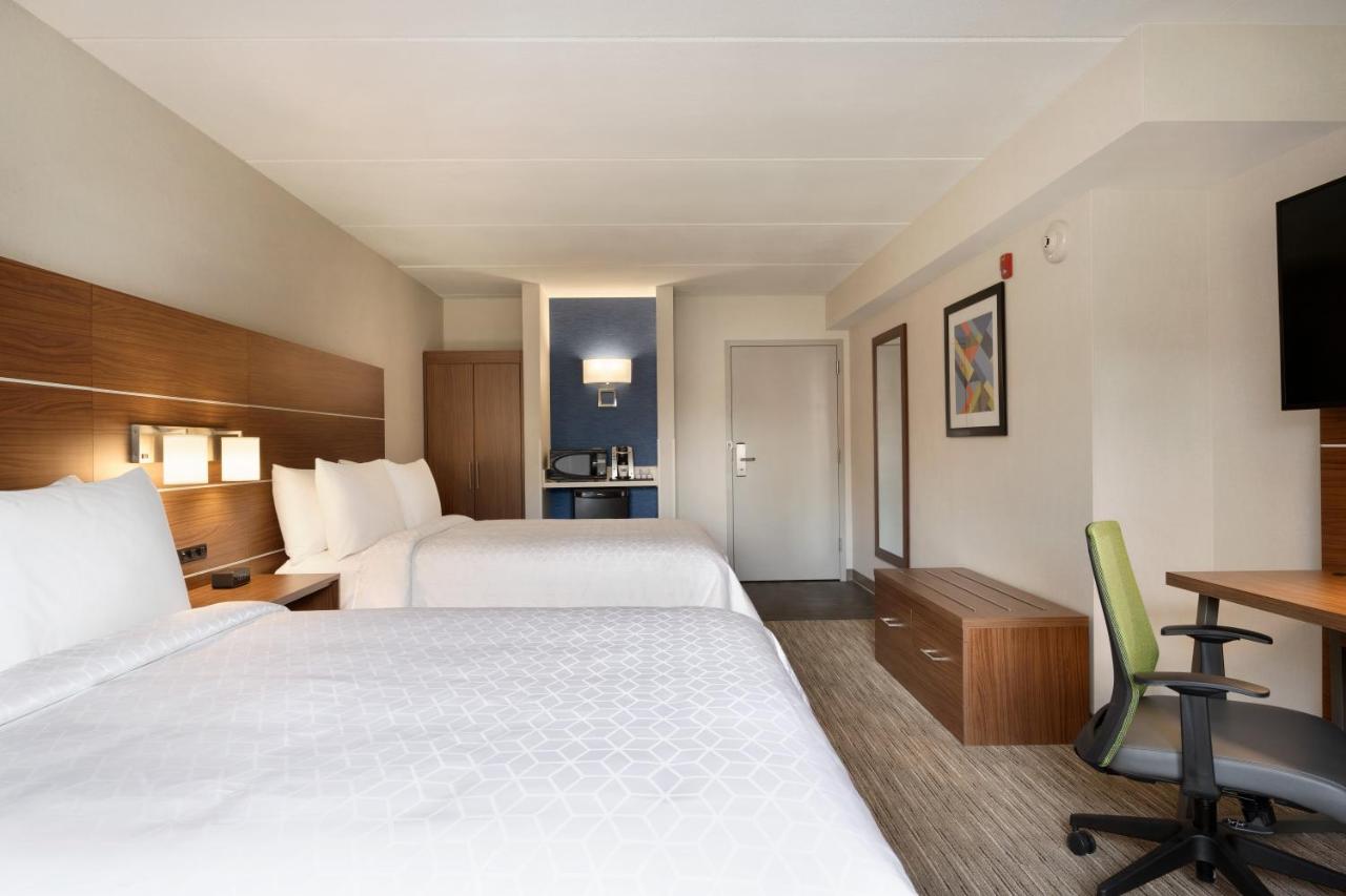 Queen Room with Two Queen Beds- Hearing Accessible Roll in Shower/Non-Smoking at Days Inn & Suites by Wyndham Plattsburgh