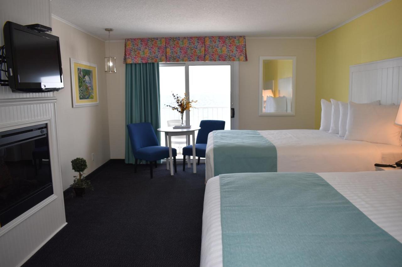 Lake Front Queen Room with Balcony and Fire Place at Breakers Resort & Beach Bar