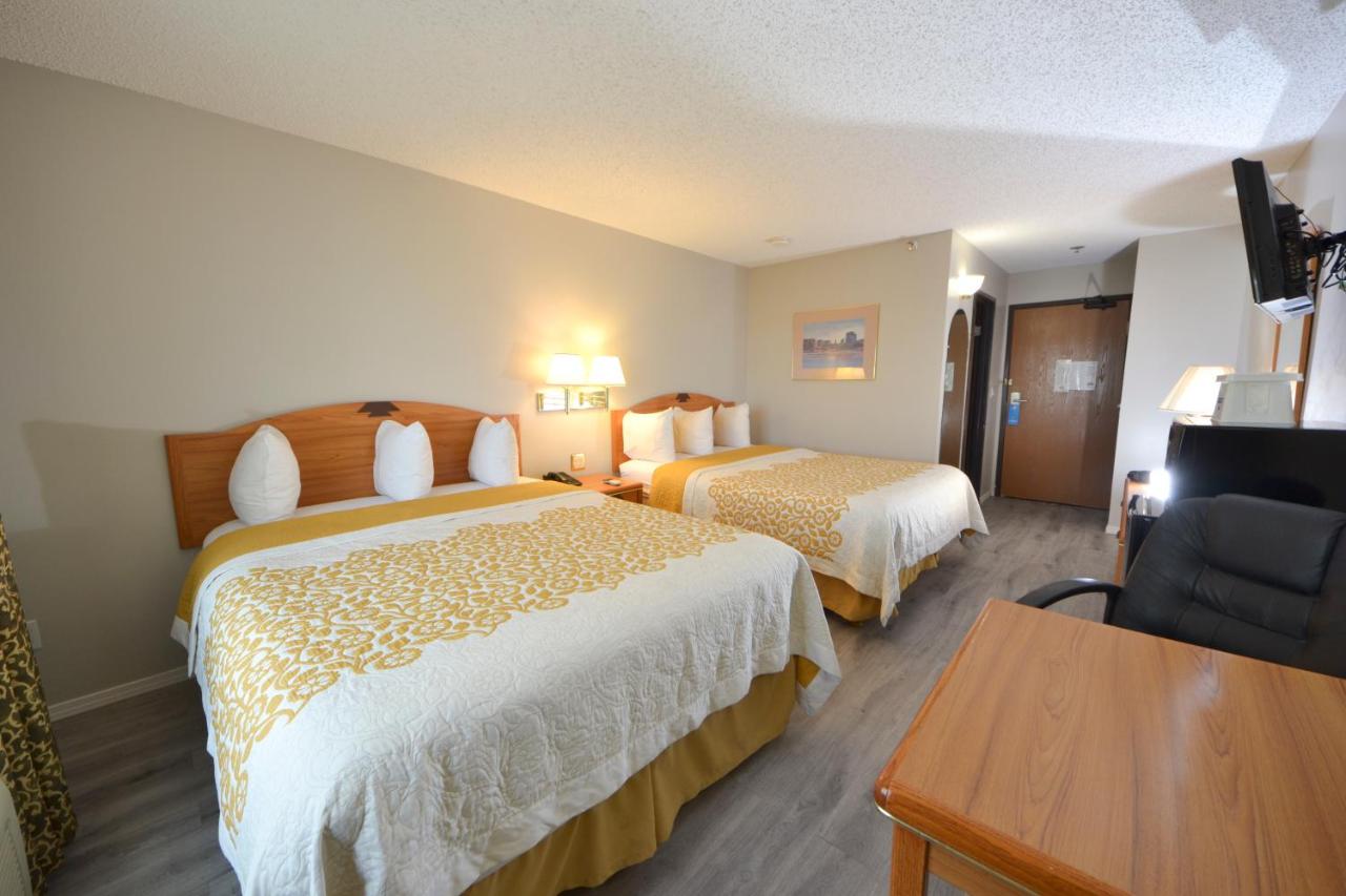 Queen Room with Two Queen Beds - Non-Smoking at Days Inn & Suites by Wyndham Airport Albuquerque