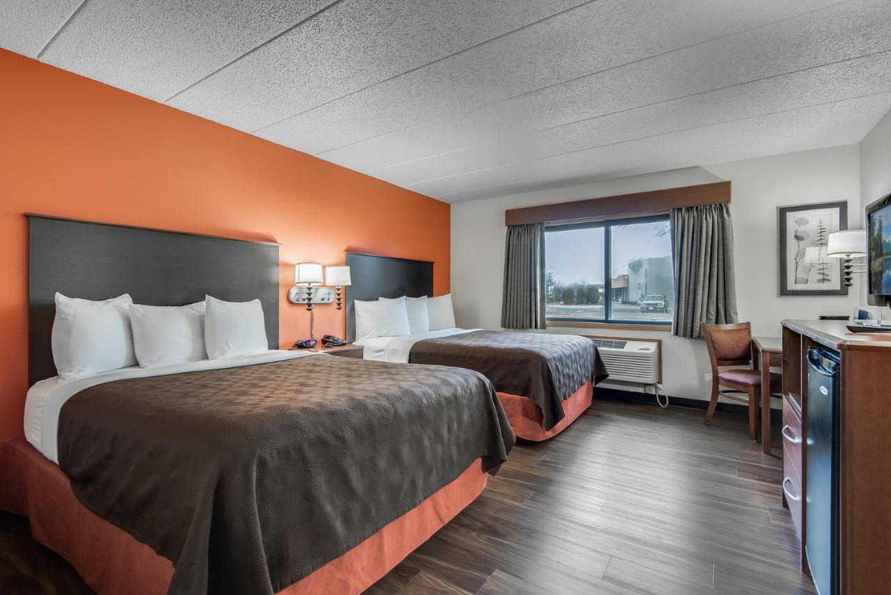 Queen Room with Two Queen Beds - Non-Smoking at AmericInn by Wyndham Coon Rapids