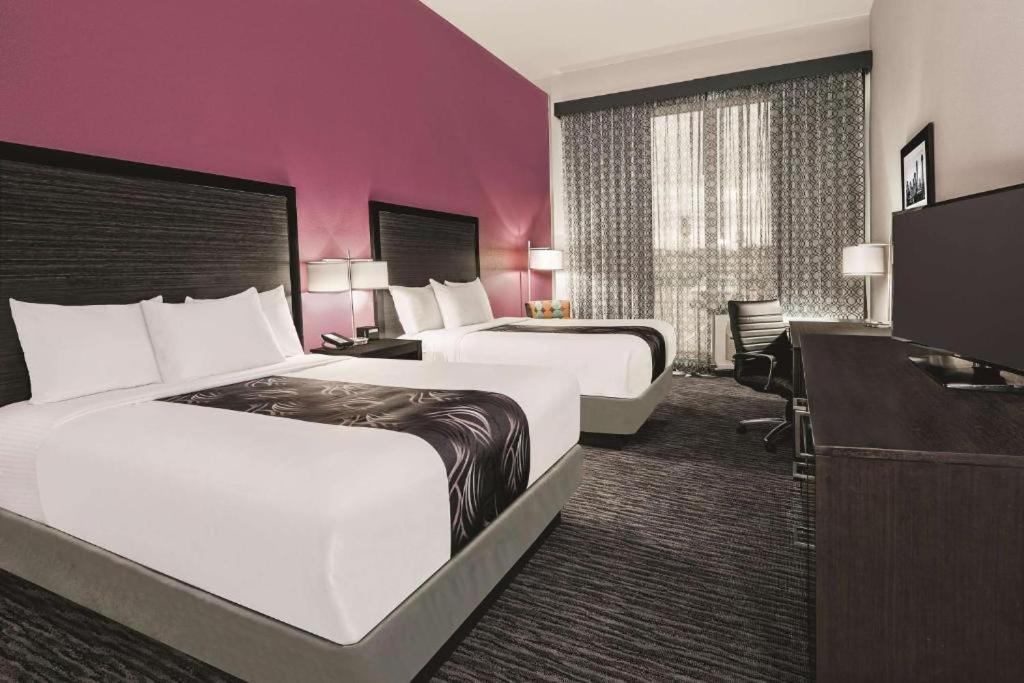 Queen Room with Two Queen Beds and Bath Tub - Mobility/Hearing Accessible - Non-Smoking at La Quinta Inn & Suites by Wyndham Dallas Grand Prairie North