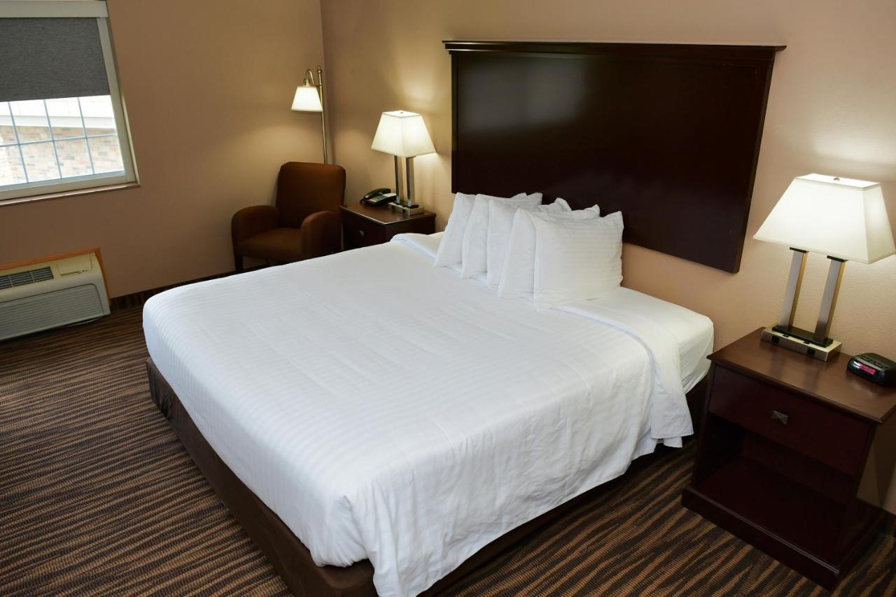King Room with Roll-In Shower - Disability Access at Cobblestone Inn & Suites - Denison Majestic Hills
