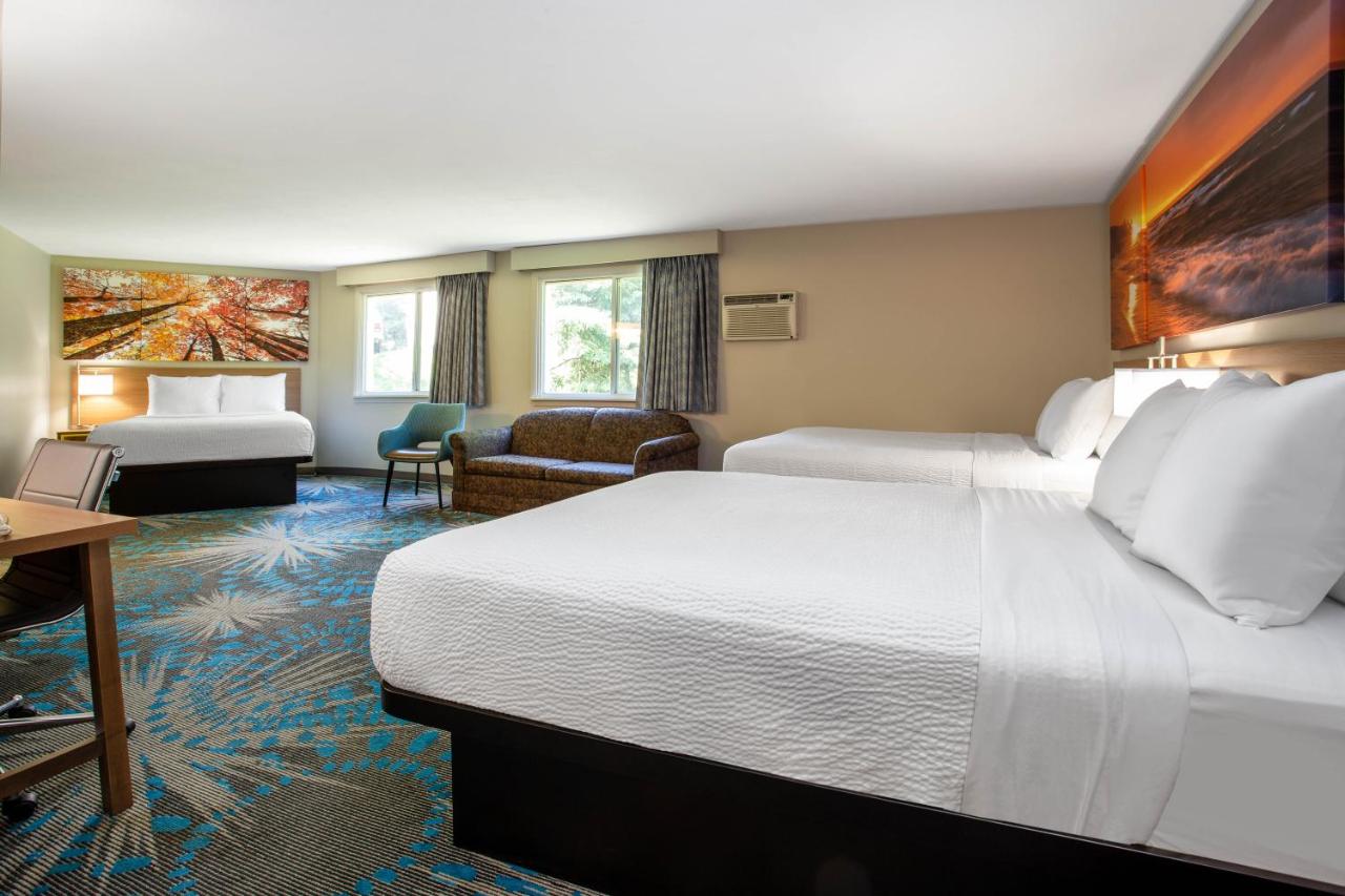 Studio Suite with Three Queen Beds - Non-Smoking at Days Inn by Wyndham Marquette