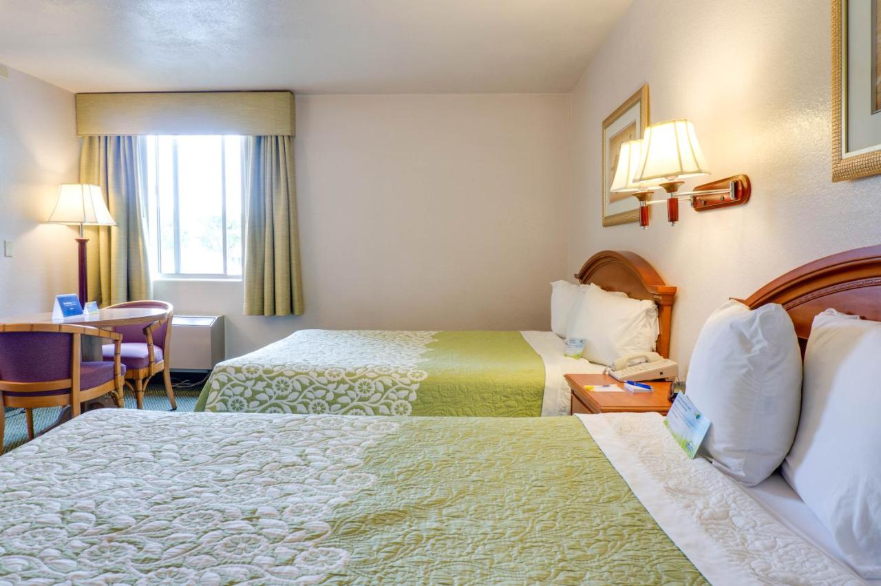 Queen Room with Two Queen Beds - Smoking at Days Inn & Suites by Wyndham Fullerton