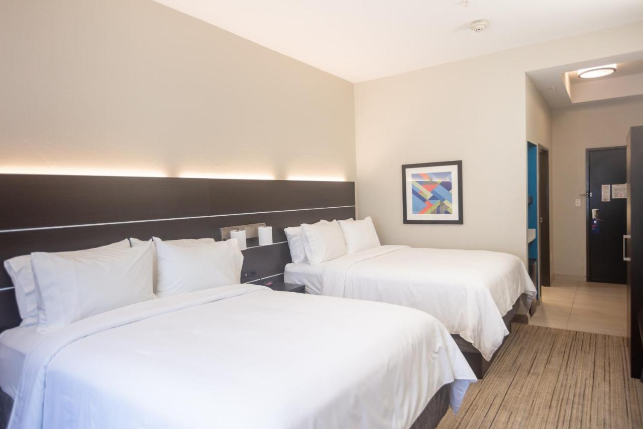 Queen Room with Two Queen Beds at Holiday Inn Express Hotel & Suites BEAUMONT NW by IHG