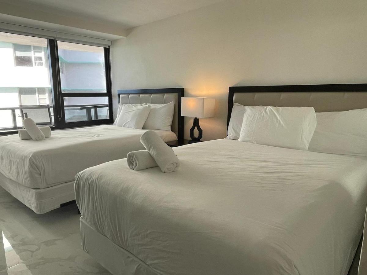 Signature Two-Bedroom 1 King + 2 Twin Beds at Alexander by Design Suites