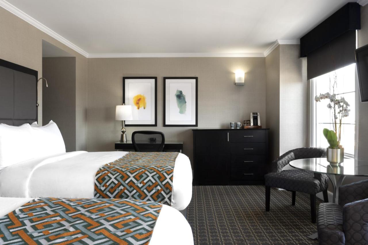 Queen Room with Two Queen Beds - Non-Smoking at voco The Tiger Hotel Columbia, MO by IHG