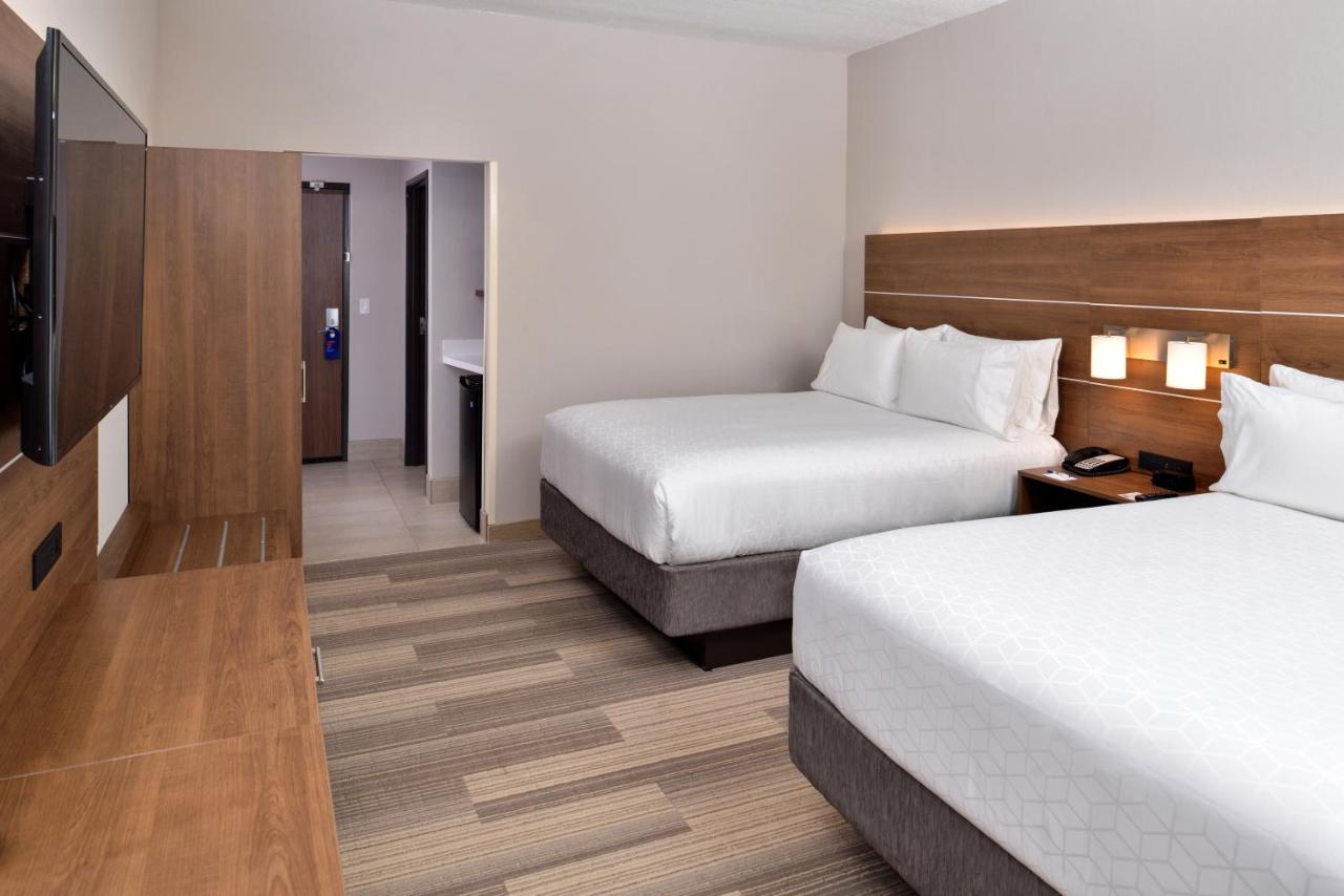 Queen Room with Two Queen Beds - Non-Smoking at Holiday Inn Express & Suites West Melbourne by IHG