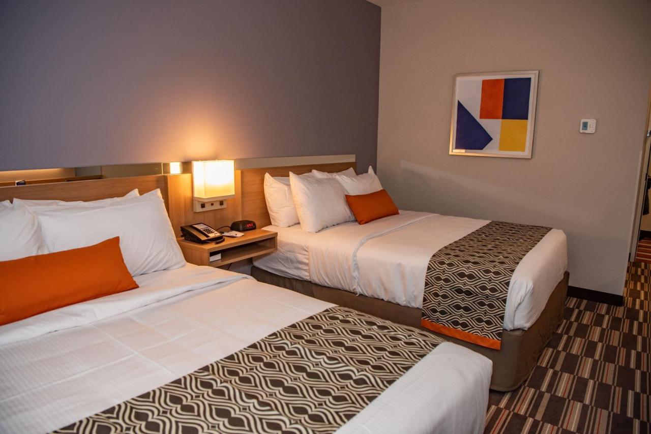 Queen Room with Two Queen Beds - Non-Smoking at Microtel Inn & Suites by Wyndham Carlisle