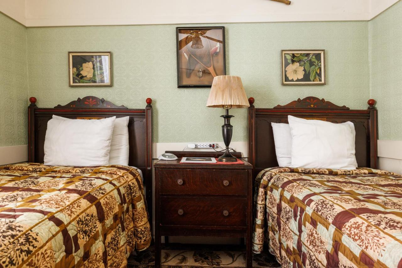 Two Twin-Sized Beds with Shared Bathroom at San Remo Hotel