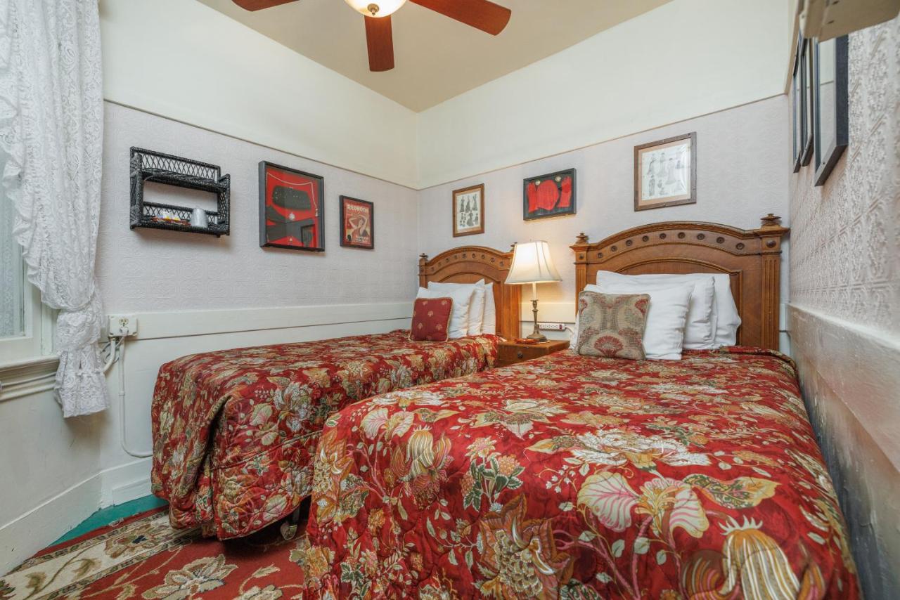 Two Twin-Sized Beds with Shared Bathroom at San Remo Hotel
