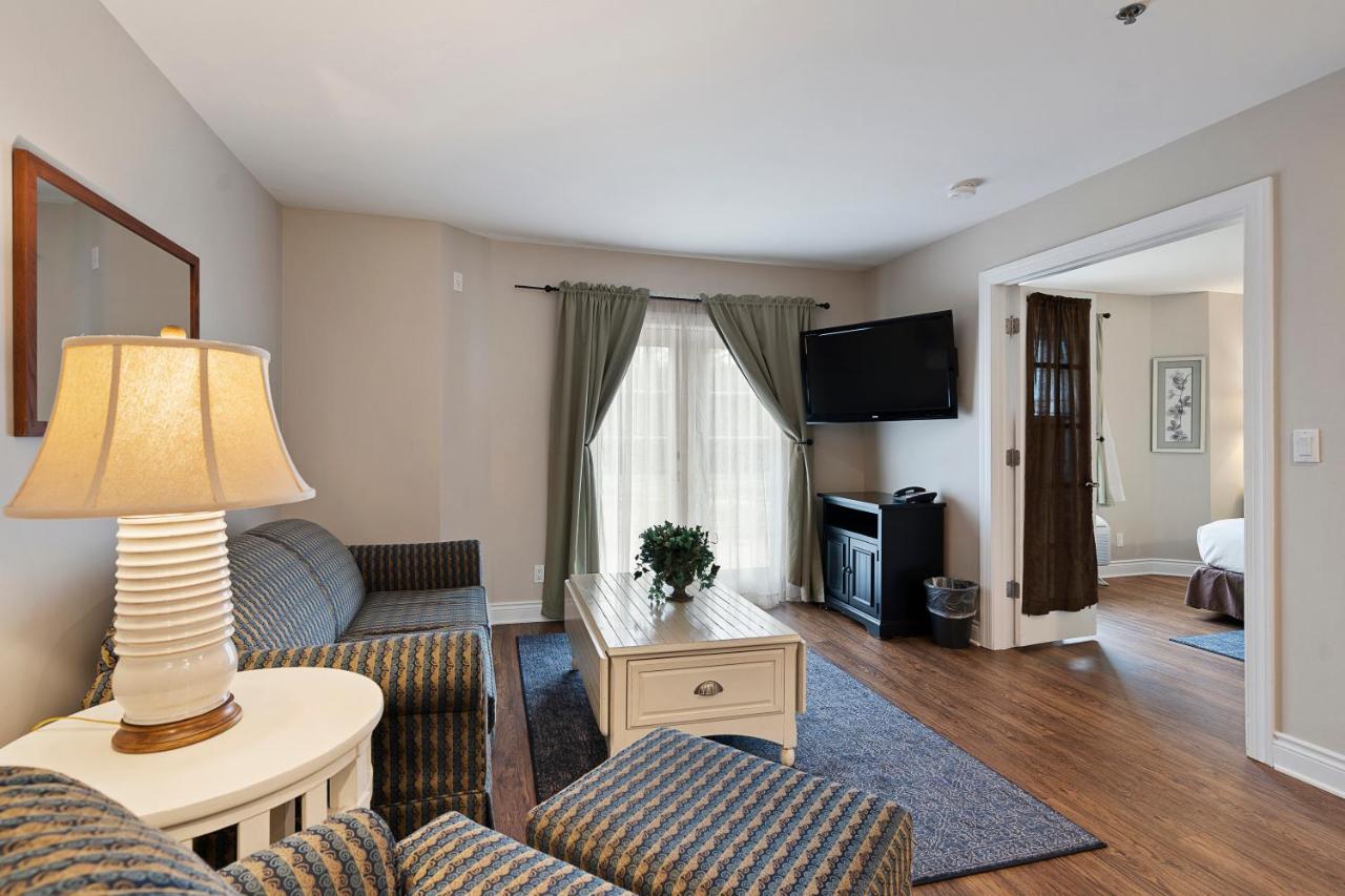King Suite with Sofa Bed and Lake View at Charlevoix Inn & Suites SureStay Collection by Best Western