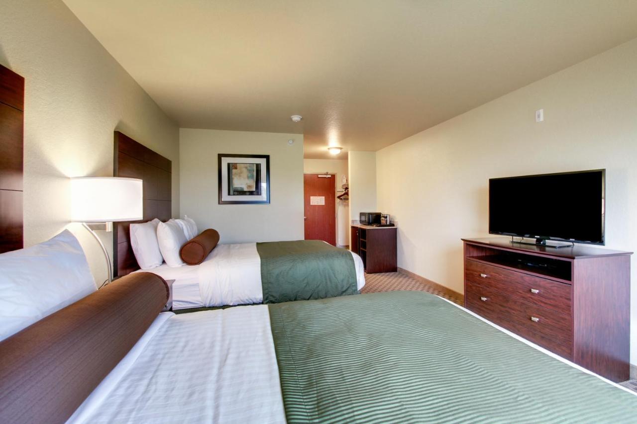 Queen Room with Two Queen Beds at Cobblestone Inn & Suites - Schuyler