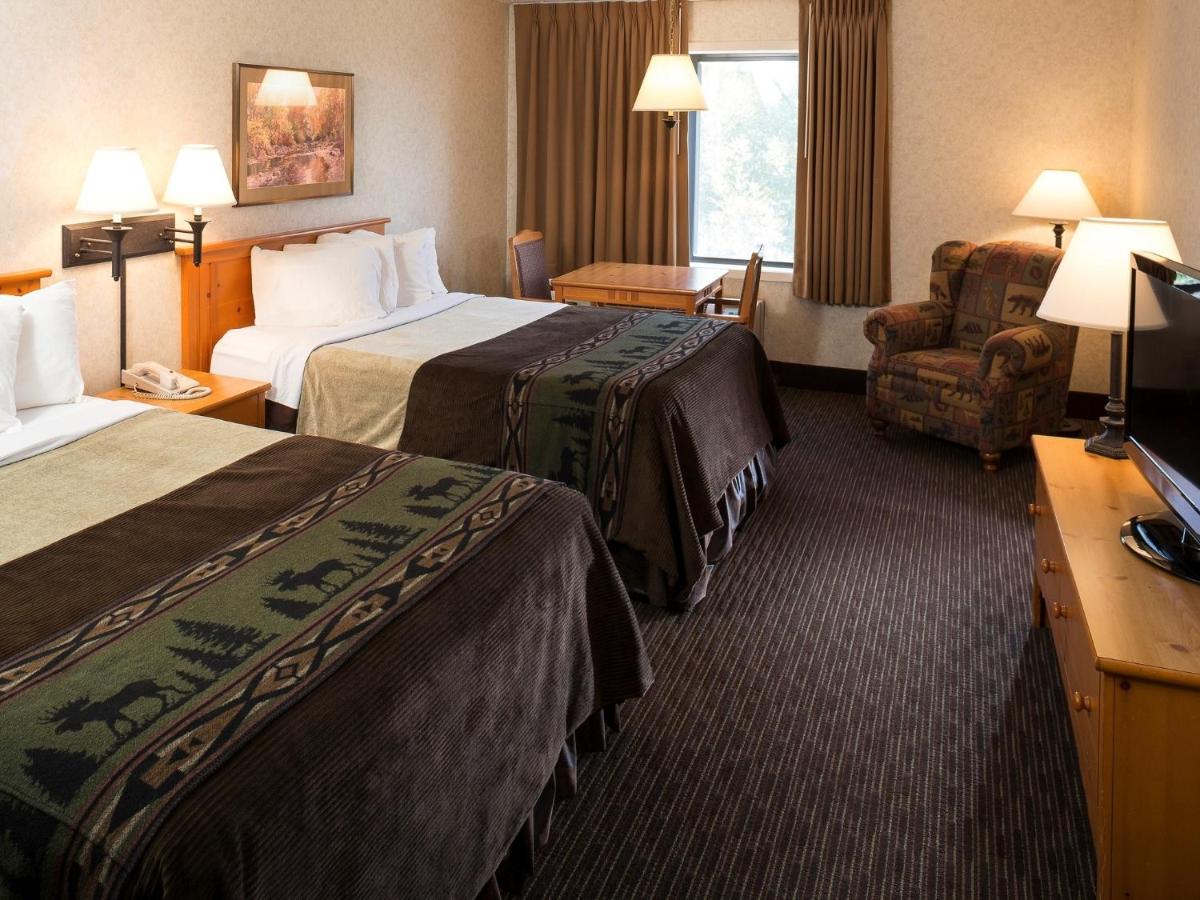 Queen Room with Two Queen Beds at Kelly Inn & Suites Mitchell South Dakota
