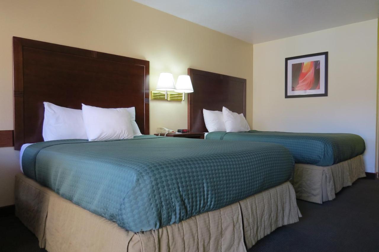 Queen Room with Two Queen Beds - Non-Smoking at America's Best Inn & Suites