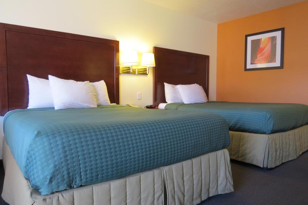Queen Room with Two Queen Beds - Non-Smoking at America's Best Inn & Suites