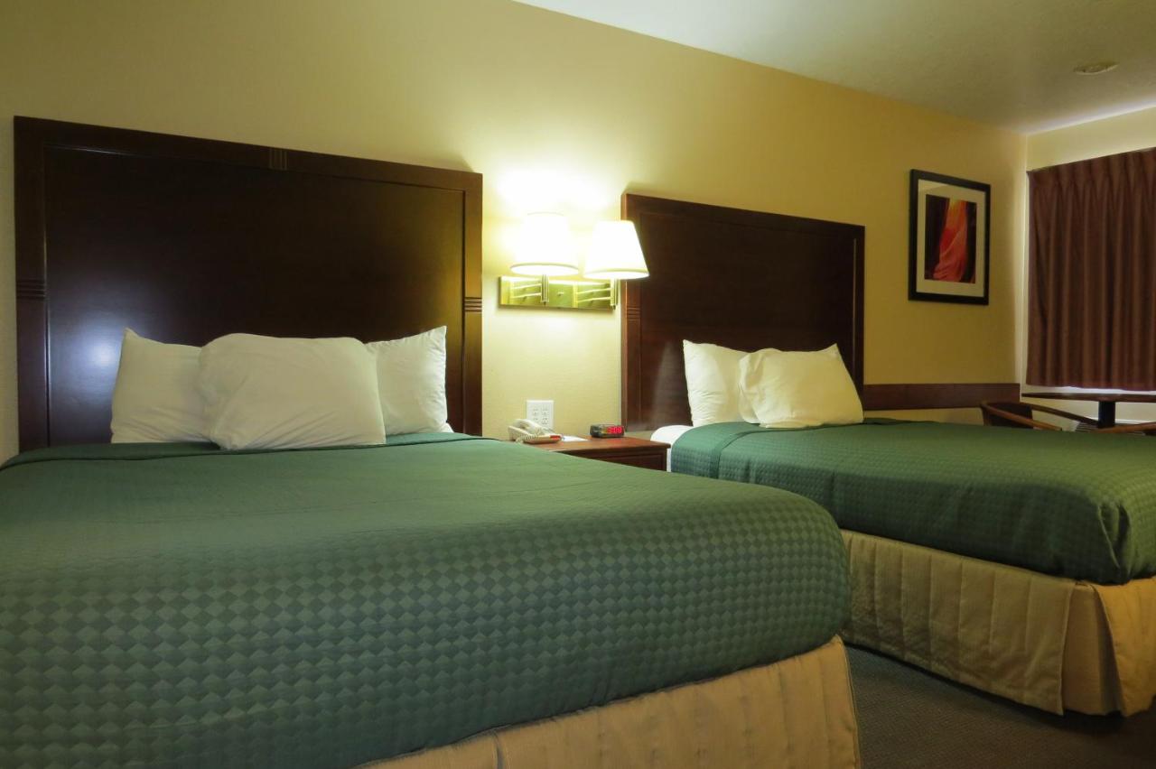 Queen Room with Two Queen Beds - Non-Smoking at America's Best Inn & Suites