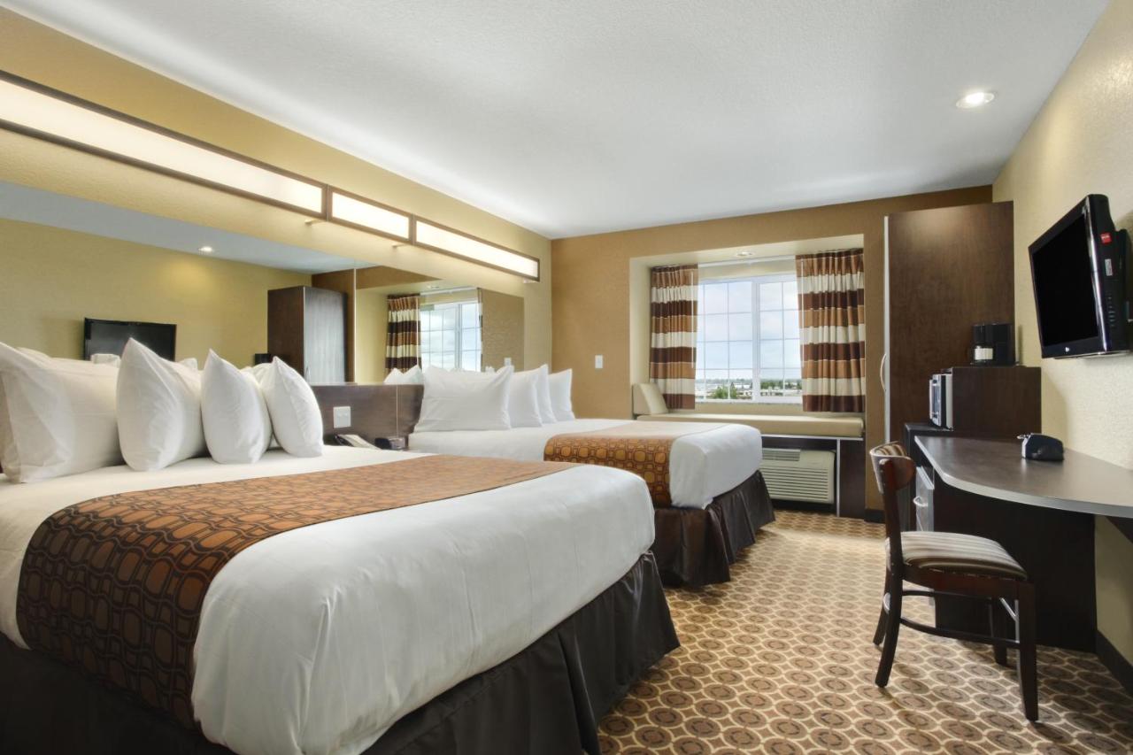 Queen Room with Two Queen Beds - Non-Smoking at Microtel Inn & Suites by Wyndham Williston