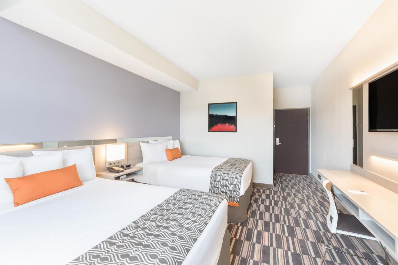 Queen Room with Two Queen Beds - Non-Smoking at Microtel Inn & Suites By Wyndham Perry
