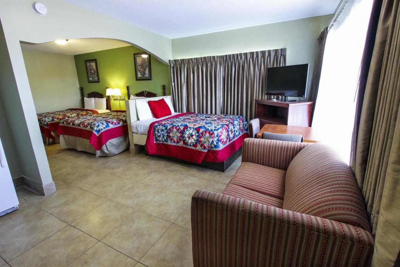 Junior Suite with Three Queen Beds - Non-Smoking at Beachcomber Resort & Club