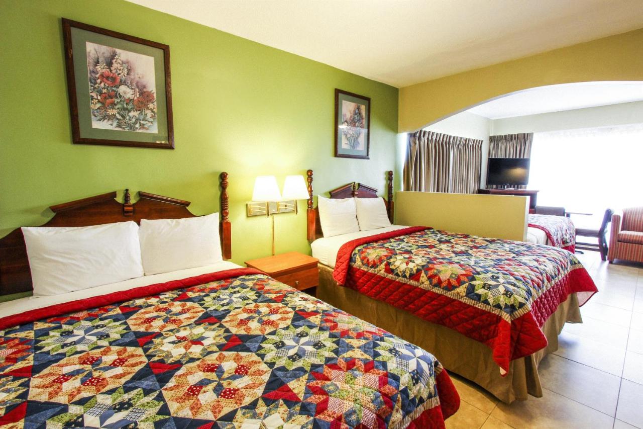 Junior Suite with Three Queen Beds - Non-Smoking at Beachcomber Resort & Club