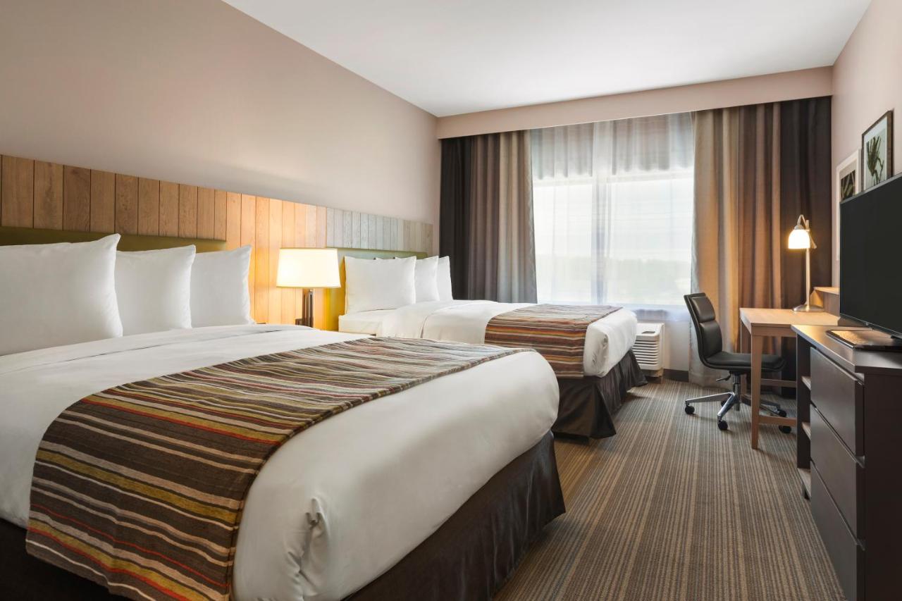 Queen Room with Two Queen Beds at Country Inn & Suites by Radisson, Smithfield-Selma, NC
